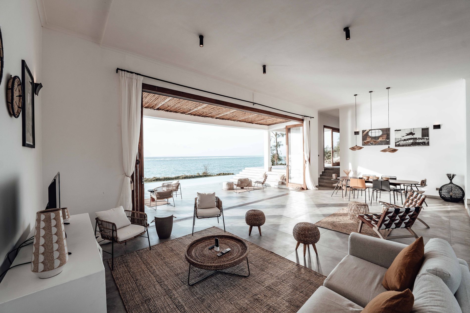 A serene villa bedroom open to the ocean